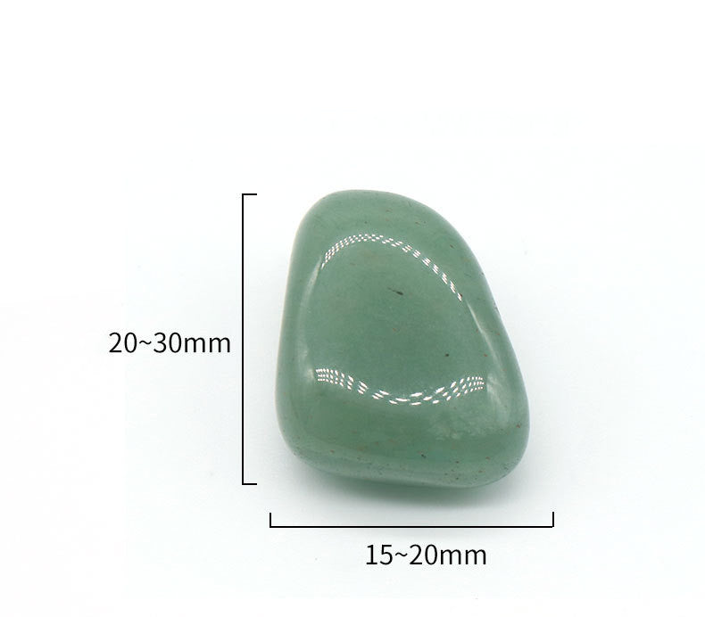 Green stone with measurement markings on a white background