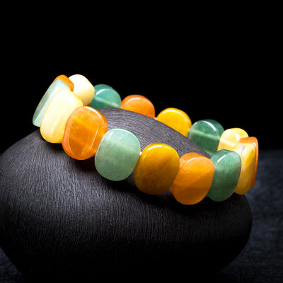 Multicolored beaded bracelet on a dark surface