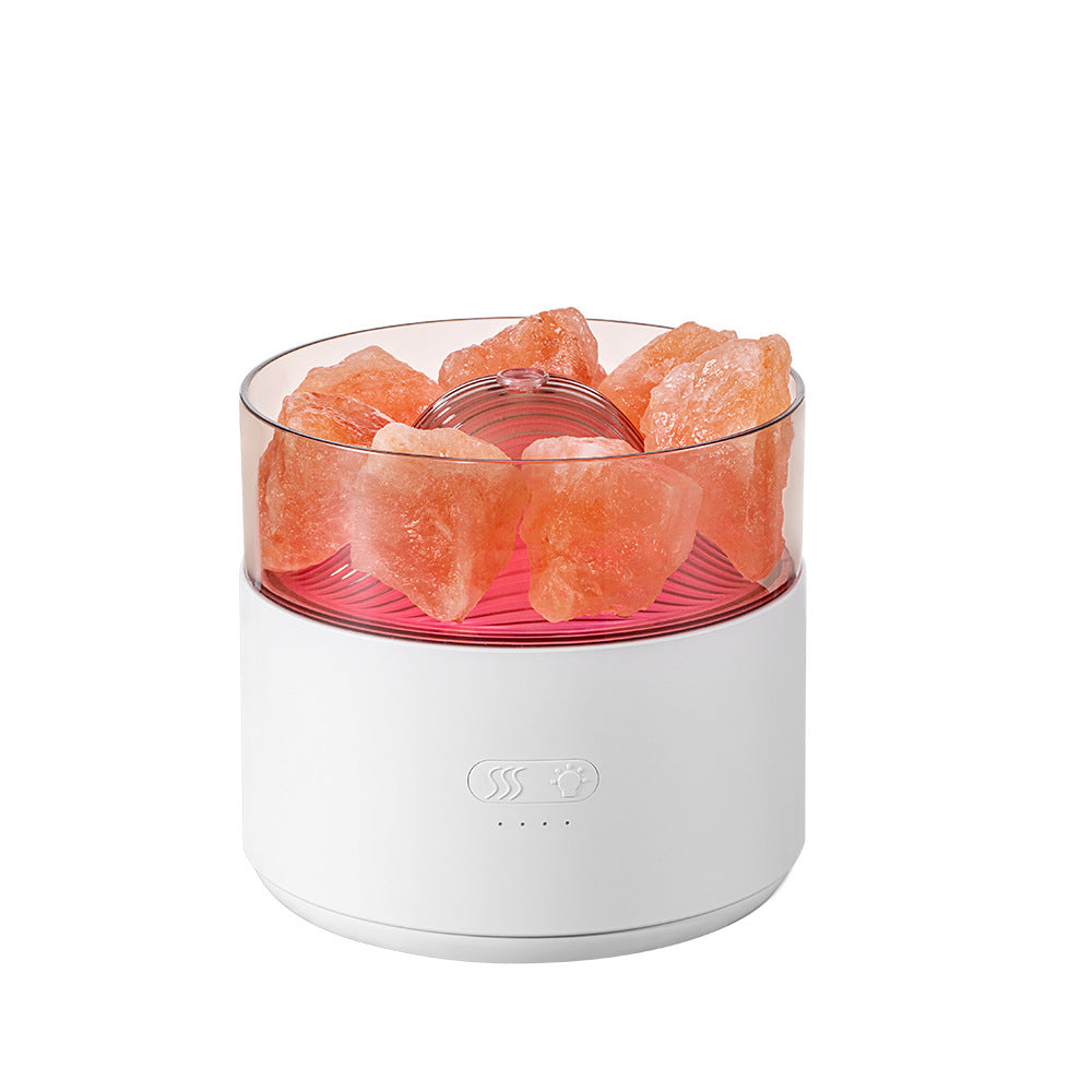White Himalayan salt lamp with pink crystal chunks on a white background