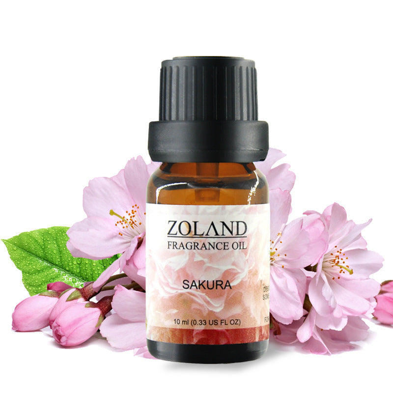 Zoland Sakura fragrance oil bottle with cherry blossoms on a white background