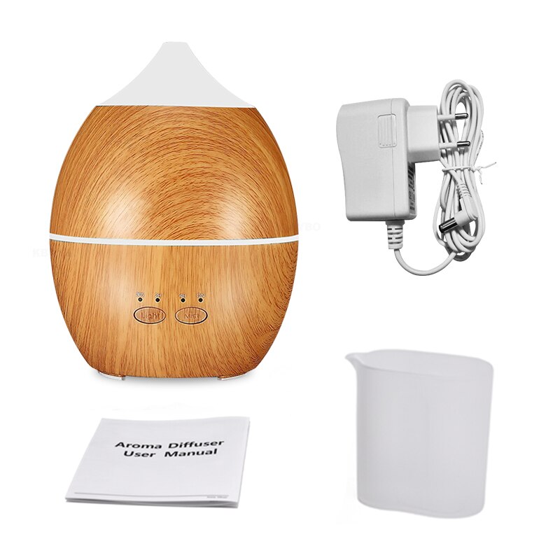 Wooden aroma diffuser with power adapter, water tank, and user manual on a white background