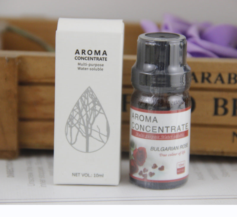 Aroma concentrate bottle and packaging on a surface with a blurred background