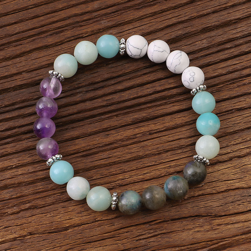 Multicolored beaded bracelet on a wooden surface