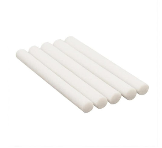 White cylindrical objects stacked on a white background