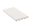 White cylindrical objects stacked on a white background