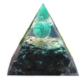 Triangular pyramid with a green marble-like top and black base on a white background