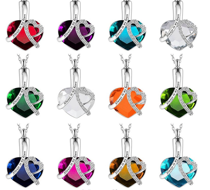 Set of heart-shaped pendant necklaces with colorful gemstones on a white background