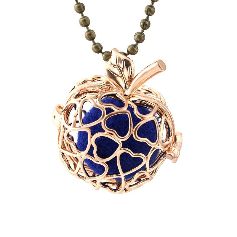 Necklace with a heart-shaped pendant featuring blue hearts and rose gold frame on a white background