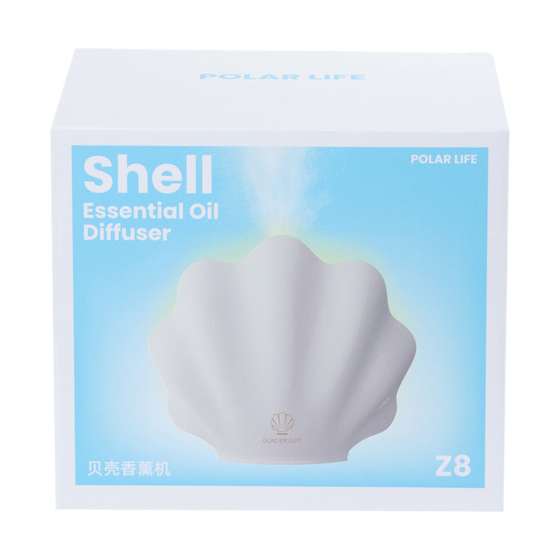 Shell-shaped essential oil diffuser packaging with 'Polar Life' branding on a white background