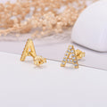 Gold letter 'A' earrings with clear stones on a light background