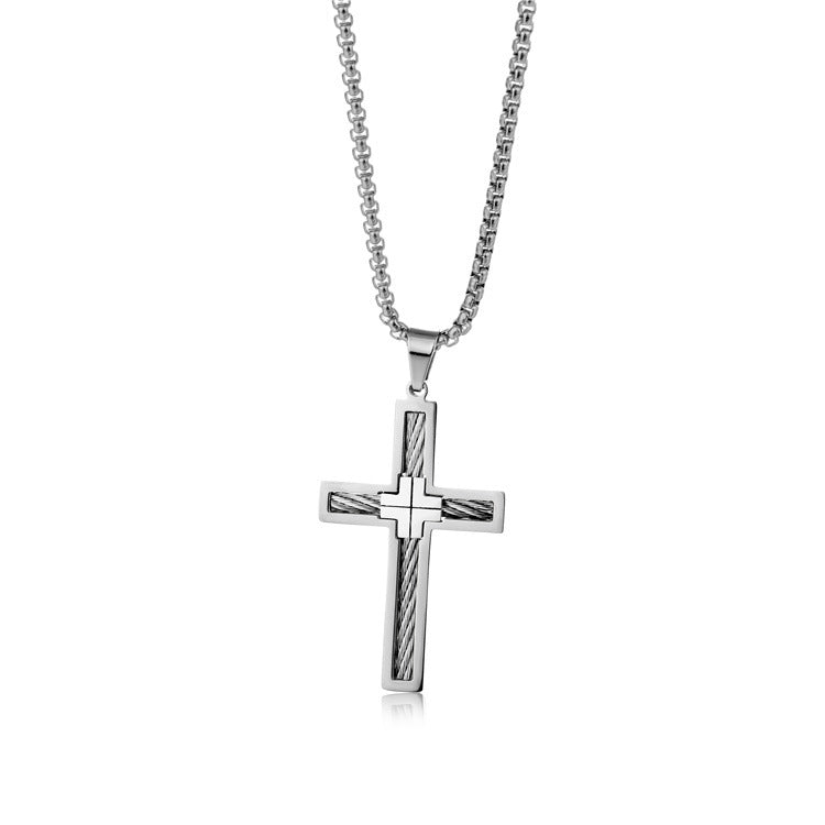 Silver cross pendant necklace on a white background