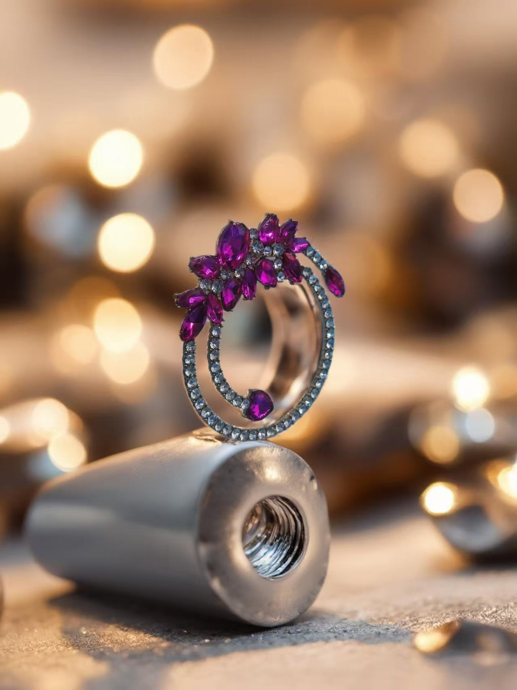 Jewelry ring with purple gemstones on a blurred background