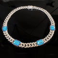 Necklace with blue gemstones and chain design on a black background