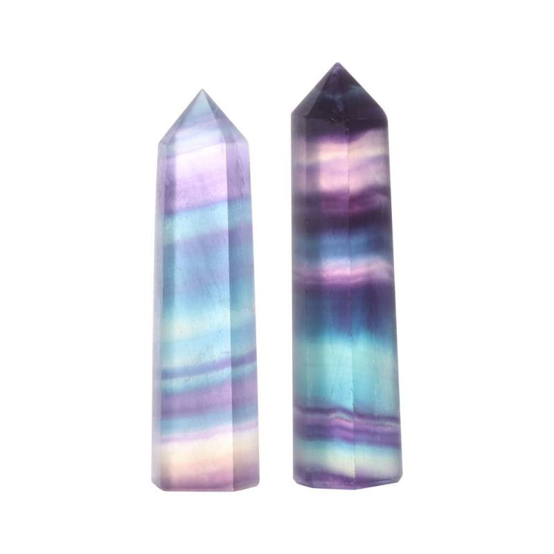 Two multicolored crystal points on a white background