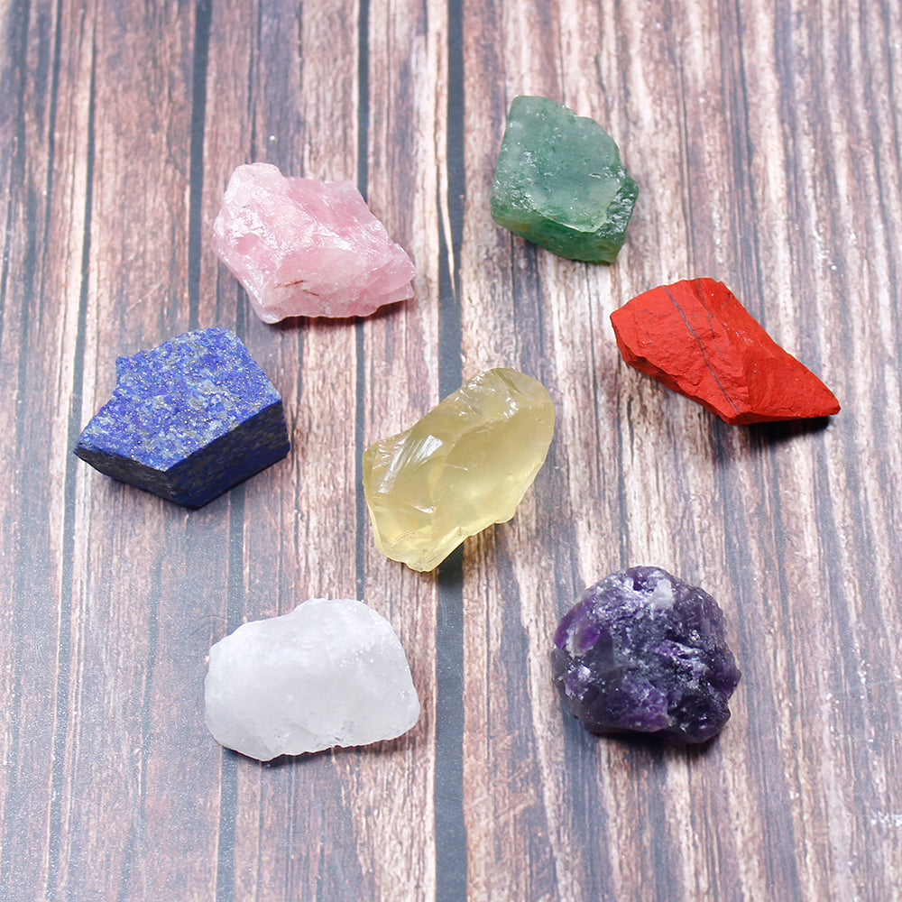 Collection of colorful crystals on a wooden surface