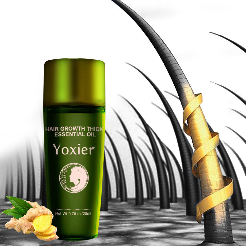 Green bottle of Yoxier hair growth thick essential oil with a palm tree background