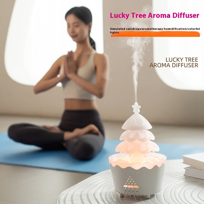 Lucky Tree Aroma Diffuser on a table with a blurred person in the background