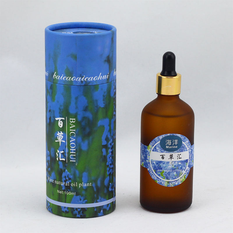 Brown glass bottle with dropper and blue cylindrical packaging on a white background