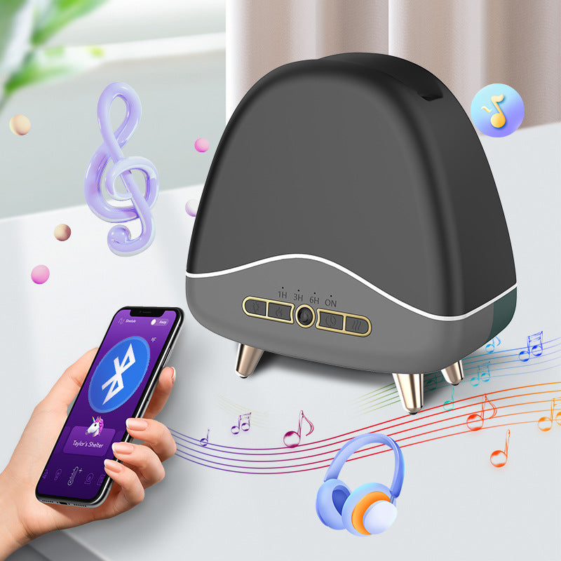 Black humidifier with smartphone control and musical elements on a light background