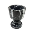 Black marble egg cup on a white background