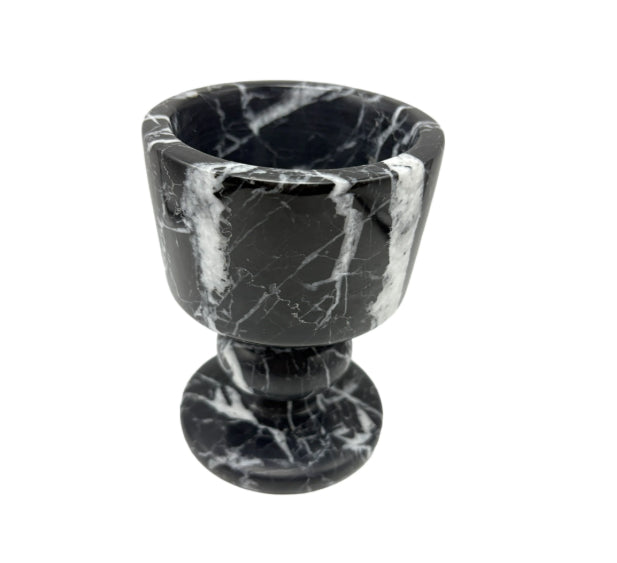 Black marble egg cup on a white background