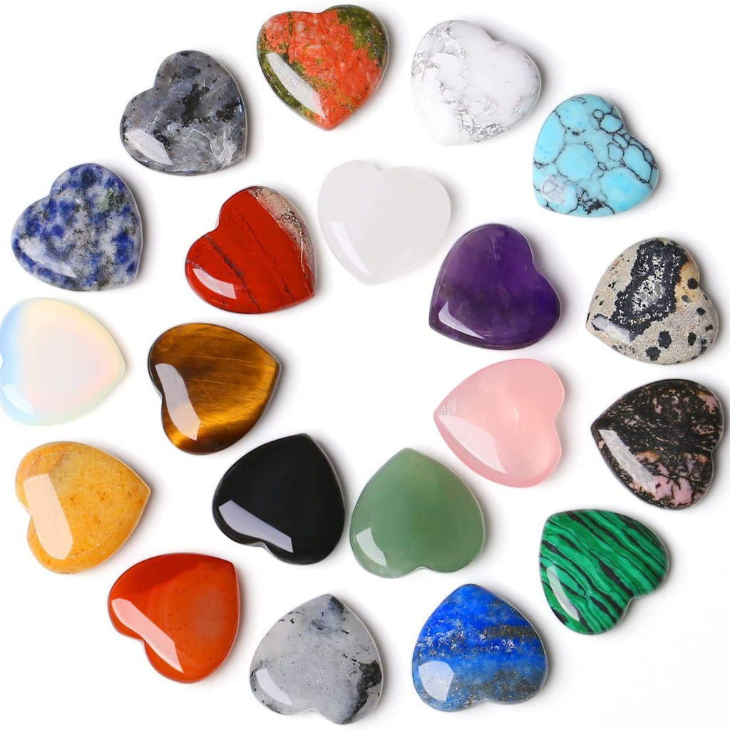 Collection of heart-shaped colorful stones on a white background