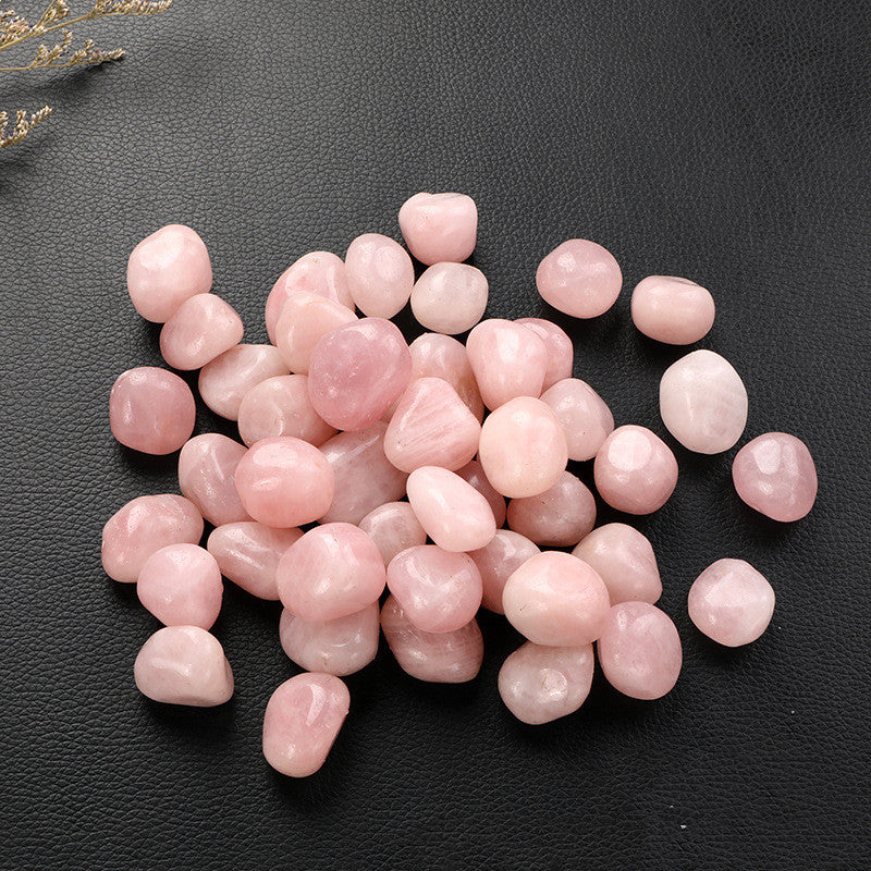 Pink stones on a black surface