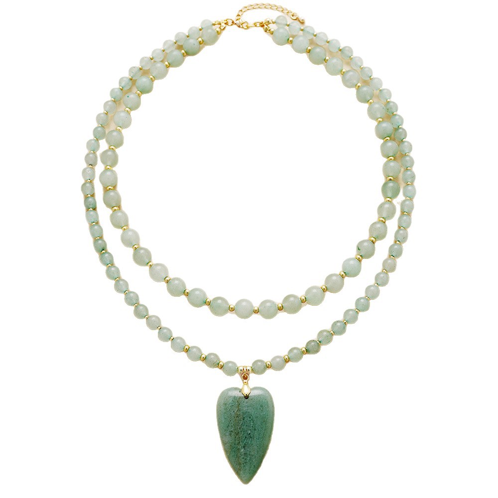 Necklace with green heart pendant and white beads on a white background