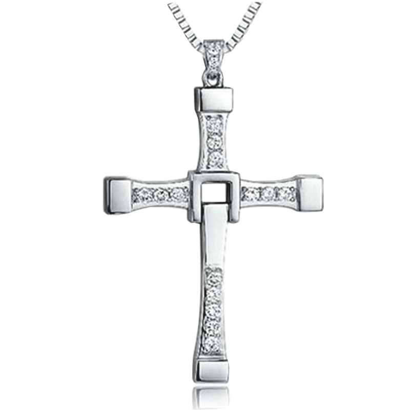 Silver cross pendant with clear stones on a white background