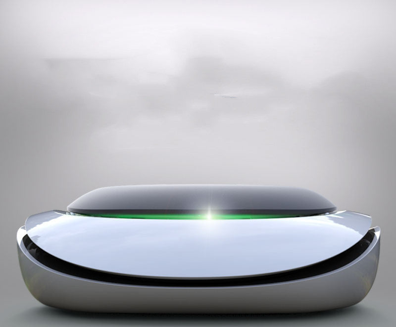 Modern, sleek device with a reflective surface on a gray background