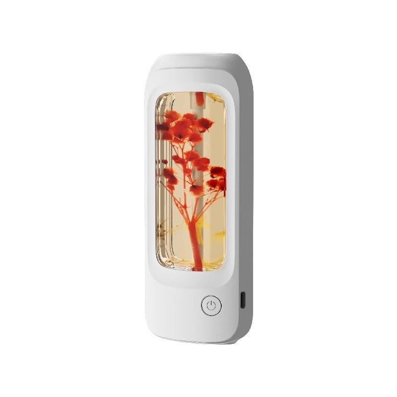 White rectangular device with a transparent front displaying red flowers on a white background
