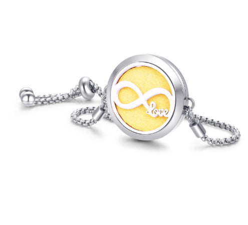 Silver necklace with a yellow disc featuring an infinity symbol and the word 'love'.
