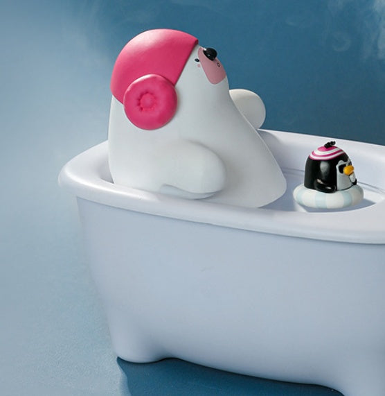 White shark toy with pink fin in a bathtub against a blue background