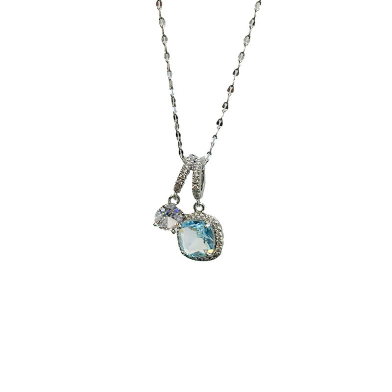 Necklace with a blue gemstone pendant on a white background