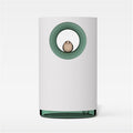 White cylindrical container with a green ring and small object inside on a white background