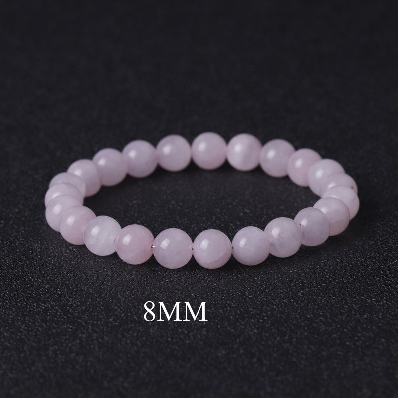 Pink beaded bracelet with 8MM beads on a dark background
