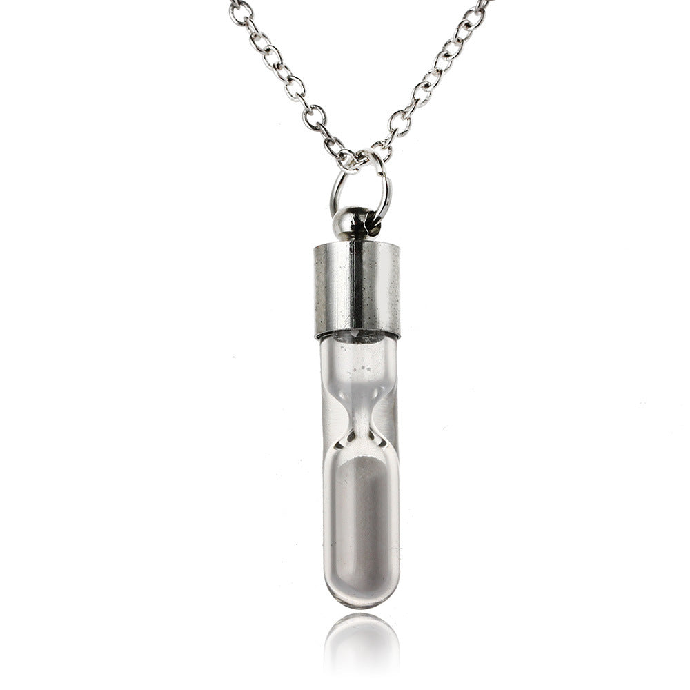 Silver hourglass pendant necklace on a white background