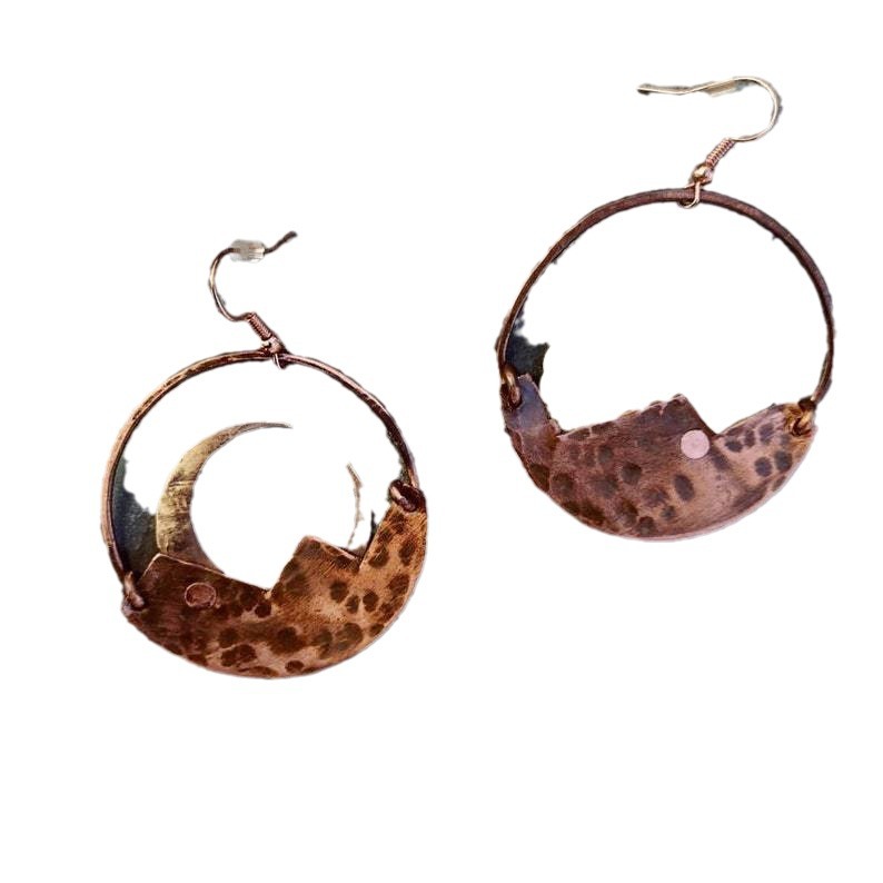 Pair of hoop earrings with a brown and gold design on a white background