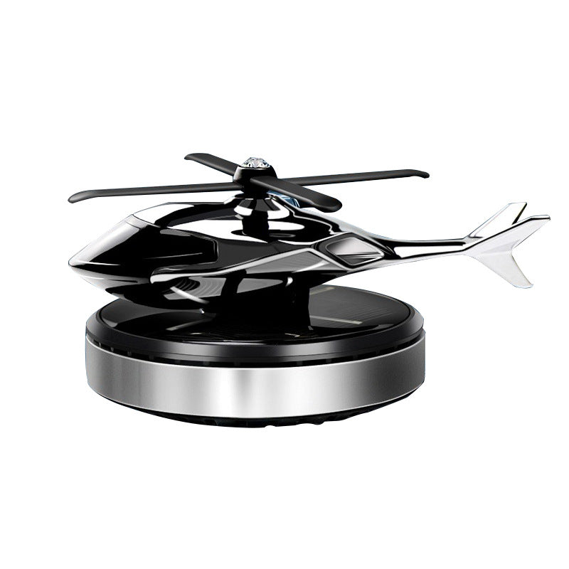 Black and silver helicopter toy on a white background