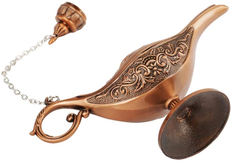 Decorative bronze lamp with intricate designs on a white background