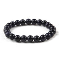 Black beaded bracelet on a white background