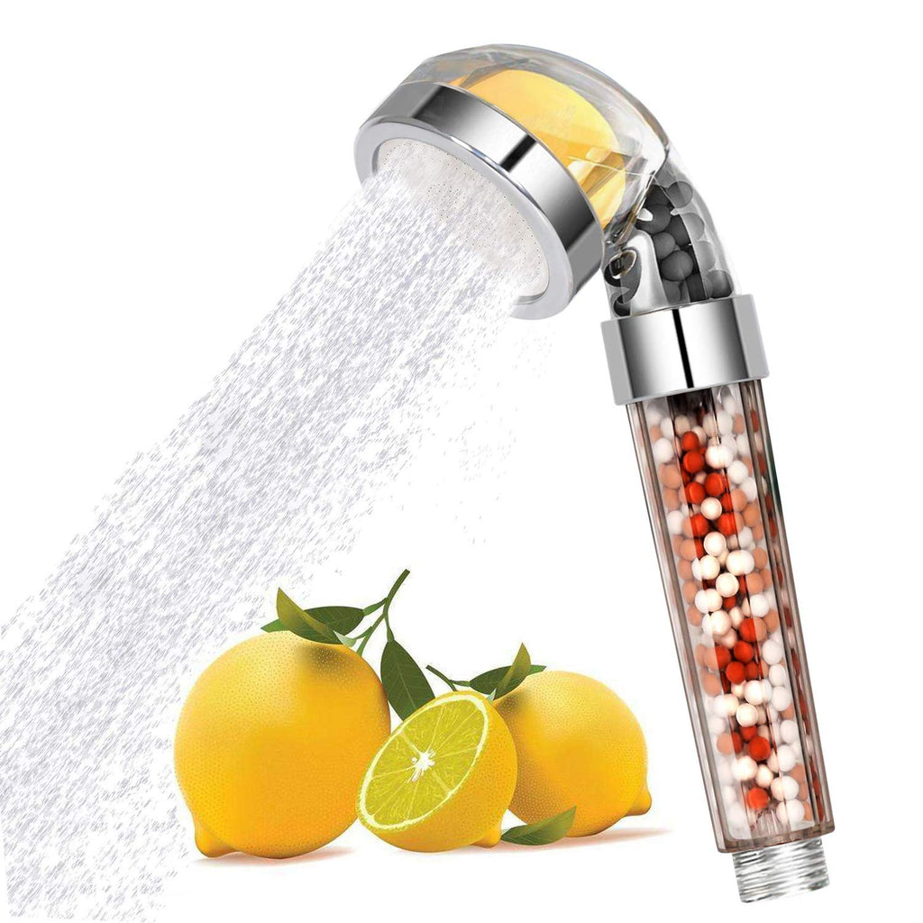 Shower head with lemon and shower beads on a white background