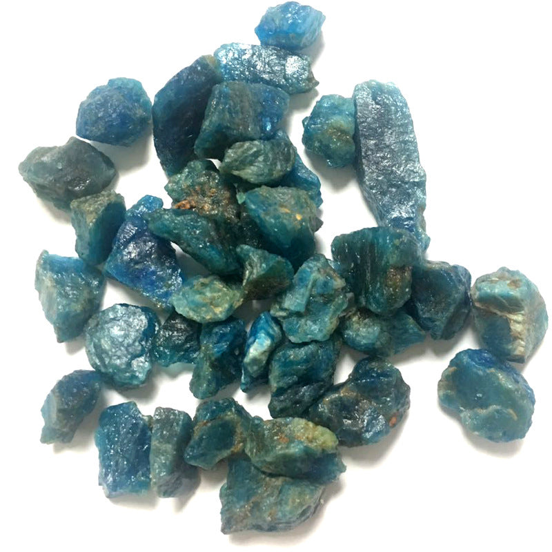 Blue rough gemstones on a white background