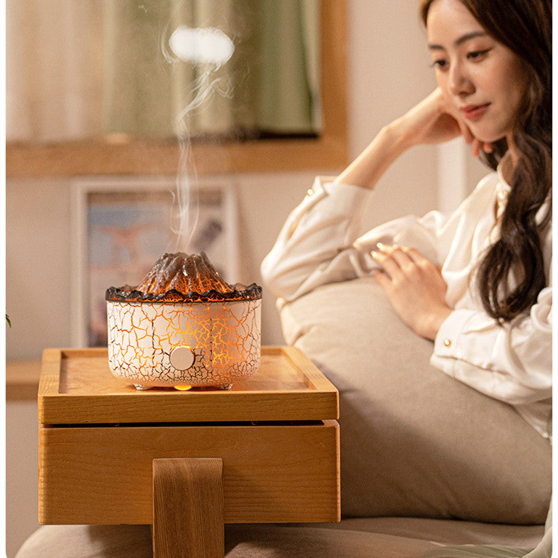 Woman sitting on a couch next to a decorative lamp emitting steam.