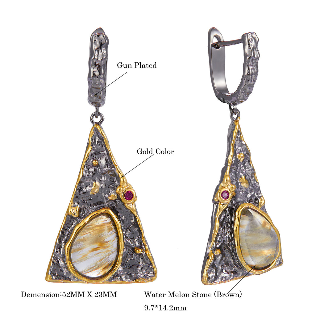 Pair of earrings with gold and silver design, featuring watermelon stone, on a white background.