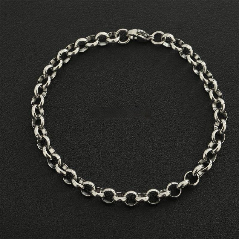 Silver chain bracelet on a black background