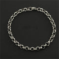 Silver chain bracelet on a black background