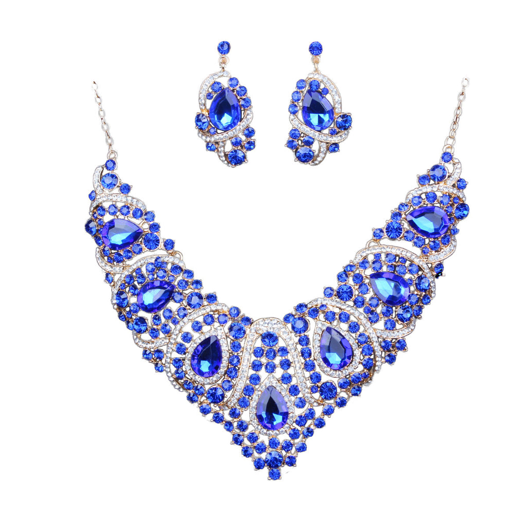 Jewelry set with blue gemstones on a white background