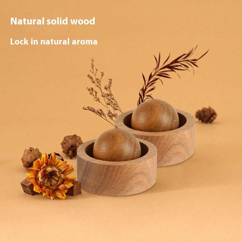 Wooden containers with natural wood balls on a beige background