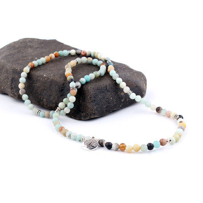 Multicolored beaded bracelets on a stone surface